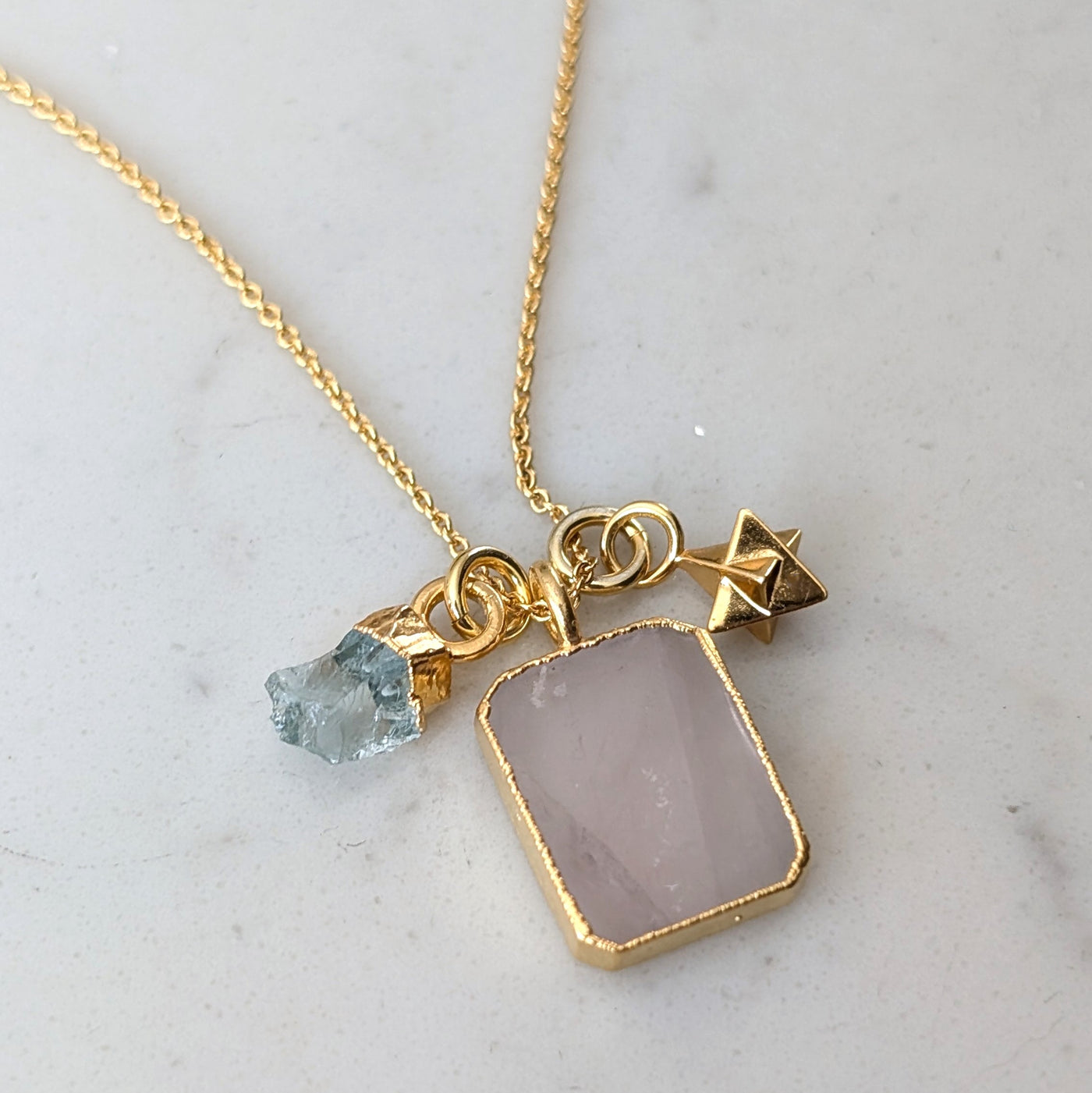 gold rose quartz, aquamarine and charm pendant necklace