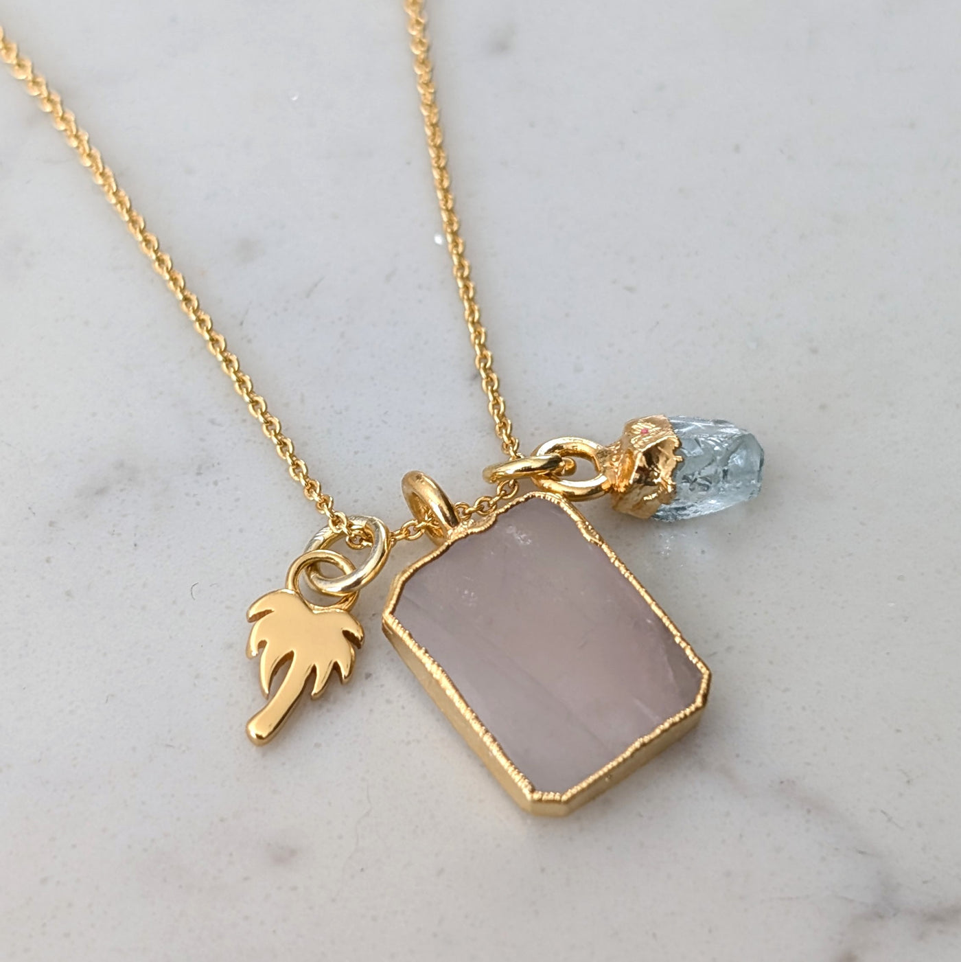 gold rose quartz, aquamarine and charm pendant necklace