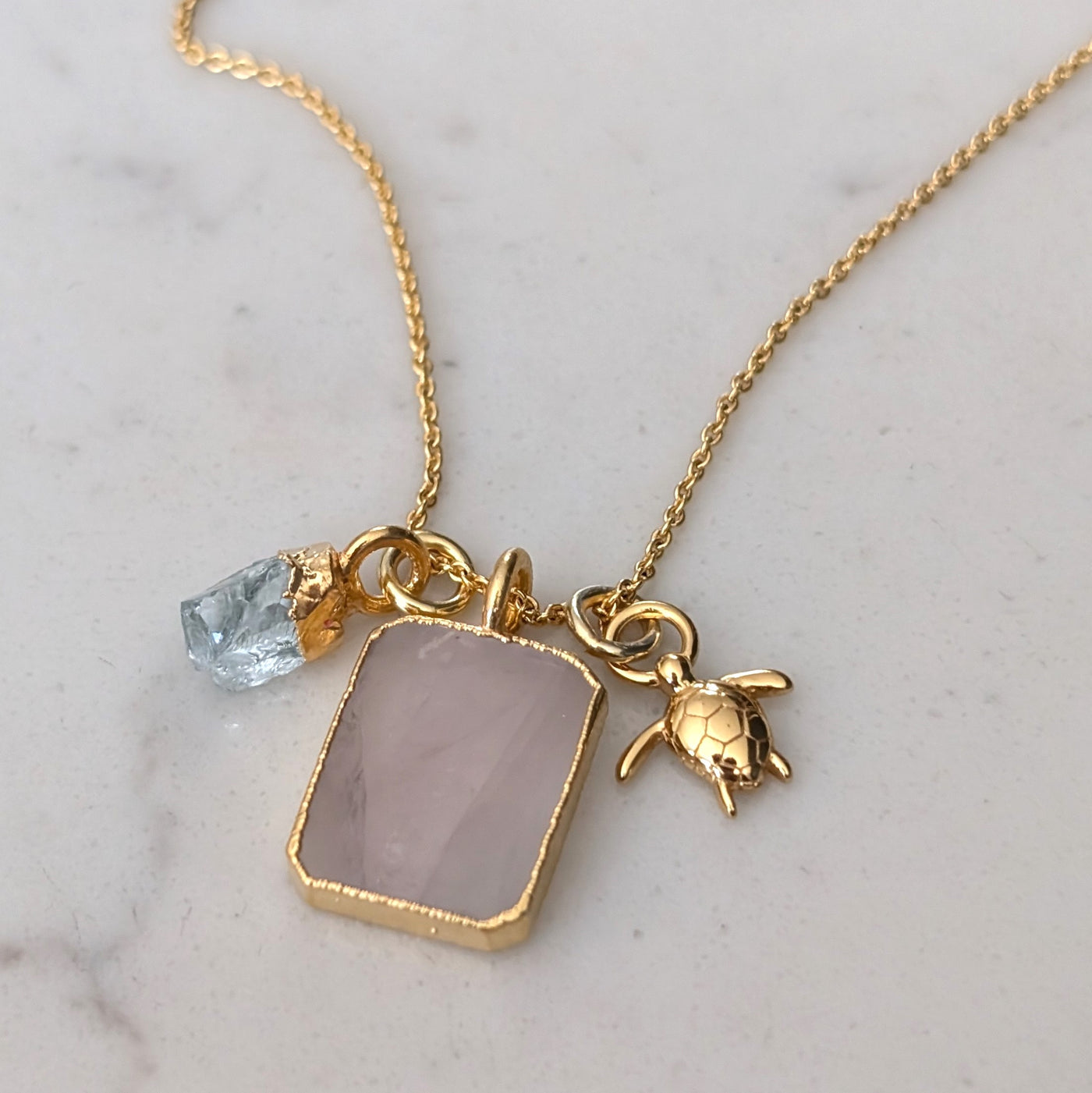 gold rose quartz, aquamarine and charm pendant necklace