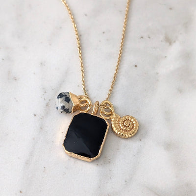 gold black onyx, dalmatian jasper and charm pendant necklace