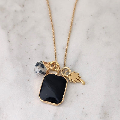 gold black onyx, dalmatian jasper and charm pendant necklace