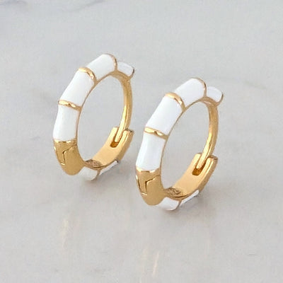gold and white enamel huggie hoop earrings