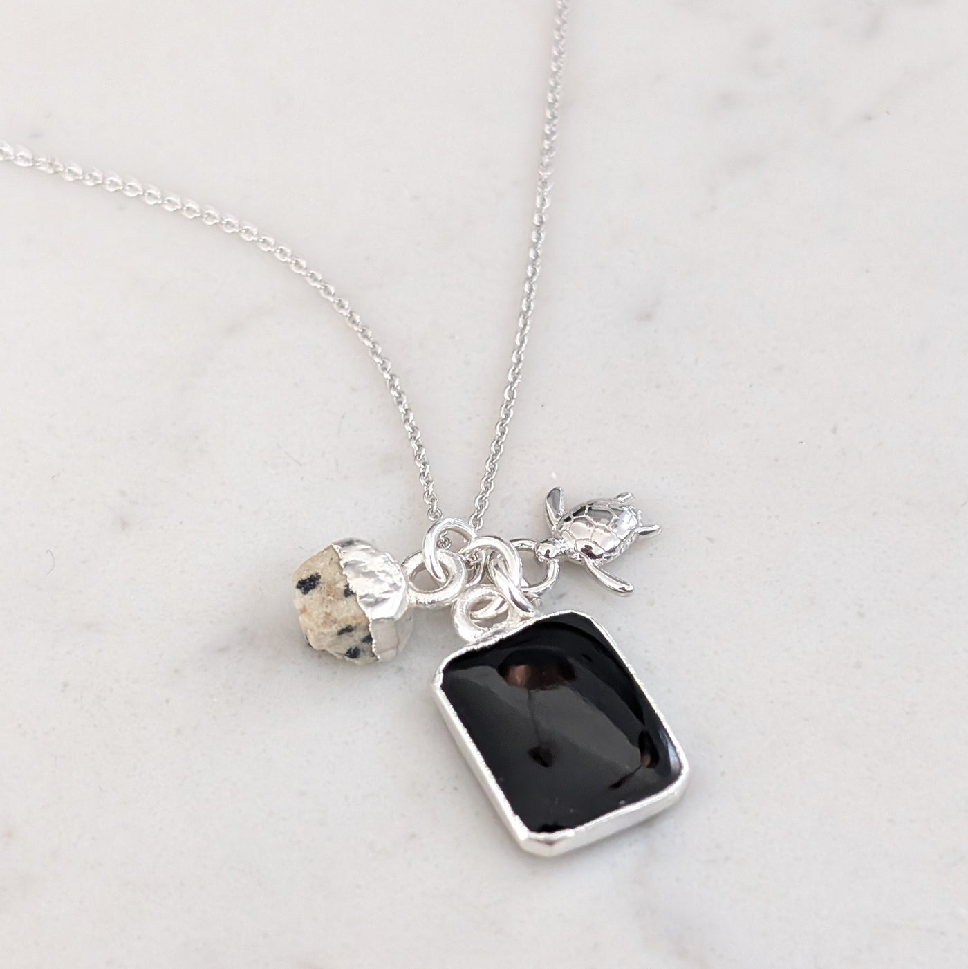 silver black onyx, dalmatian jasper and charm gemstone necklace