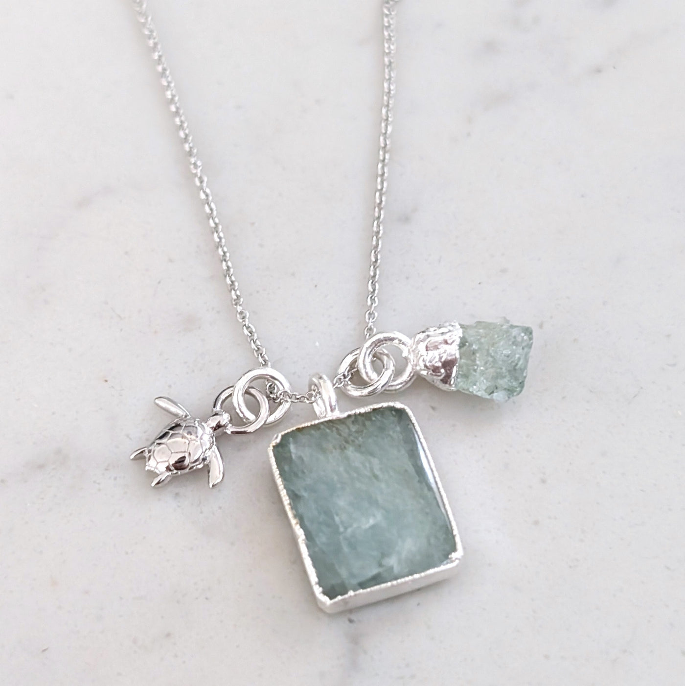 sterling silver aquamarine and charm pendant necklace