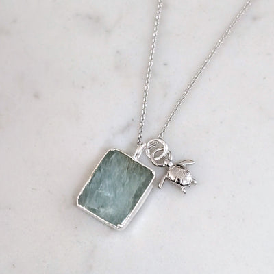 silver aquamarine and turtle charm pendant necklace