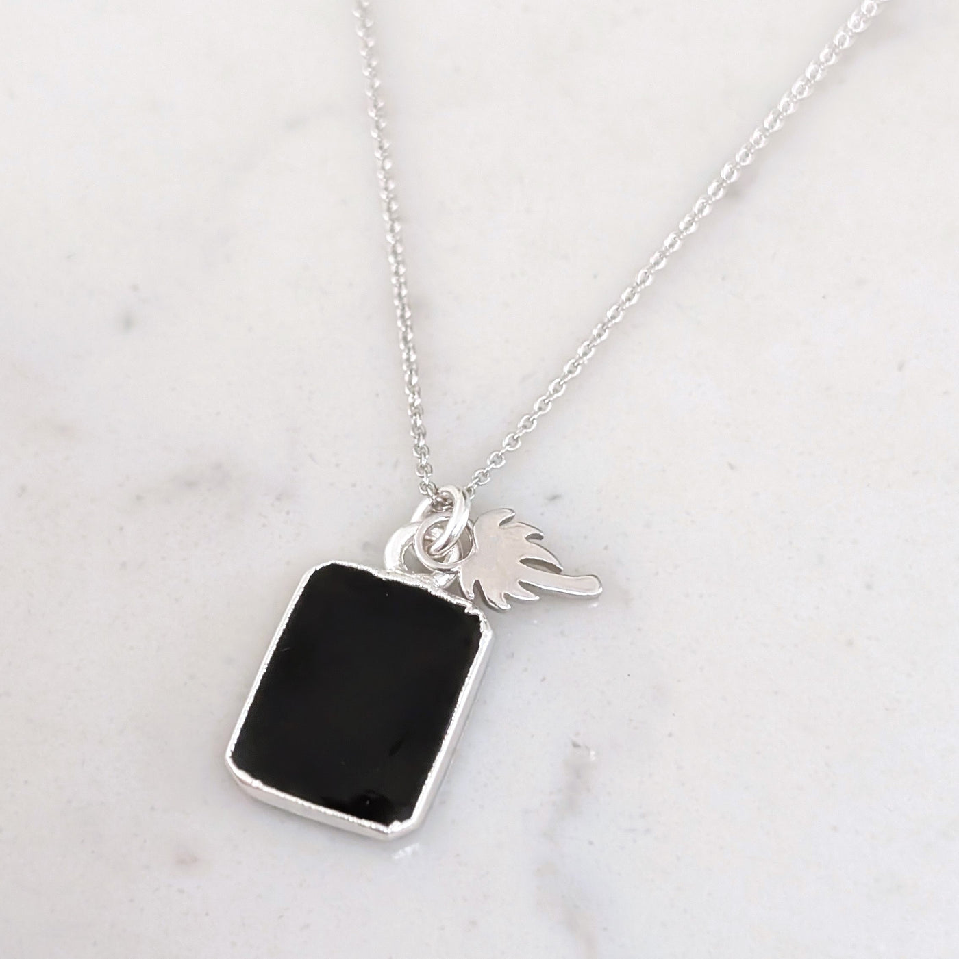 silver black onyx and charm pendant necklace