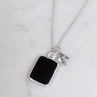 silver black onyx and charm pendant necklace