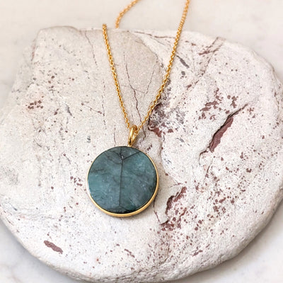 emerald circular pendant necklace